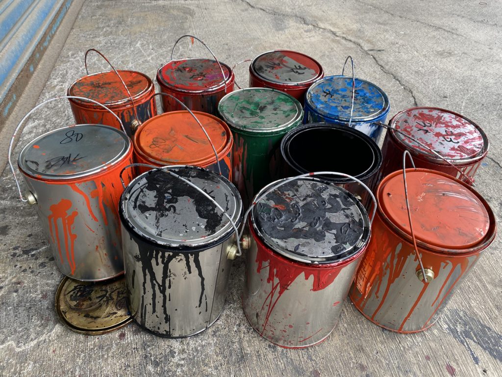 Paint tins are restricted waste and can be placed in a skip